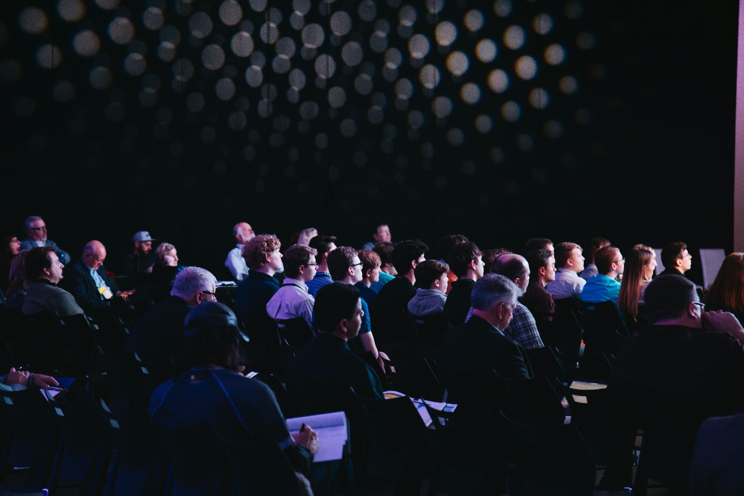 An audience of association members listening to a presentation